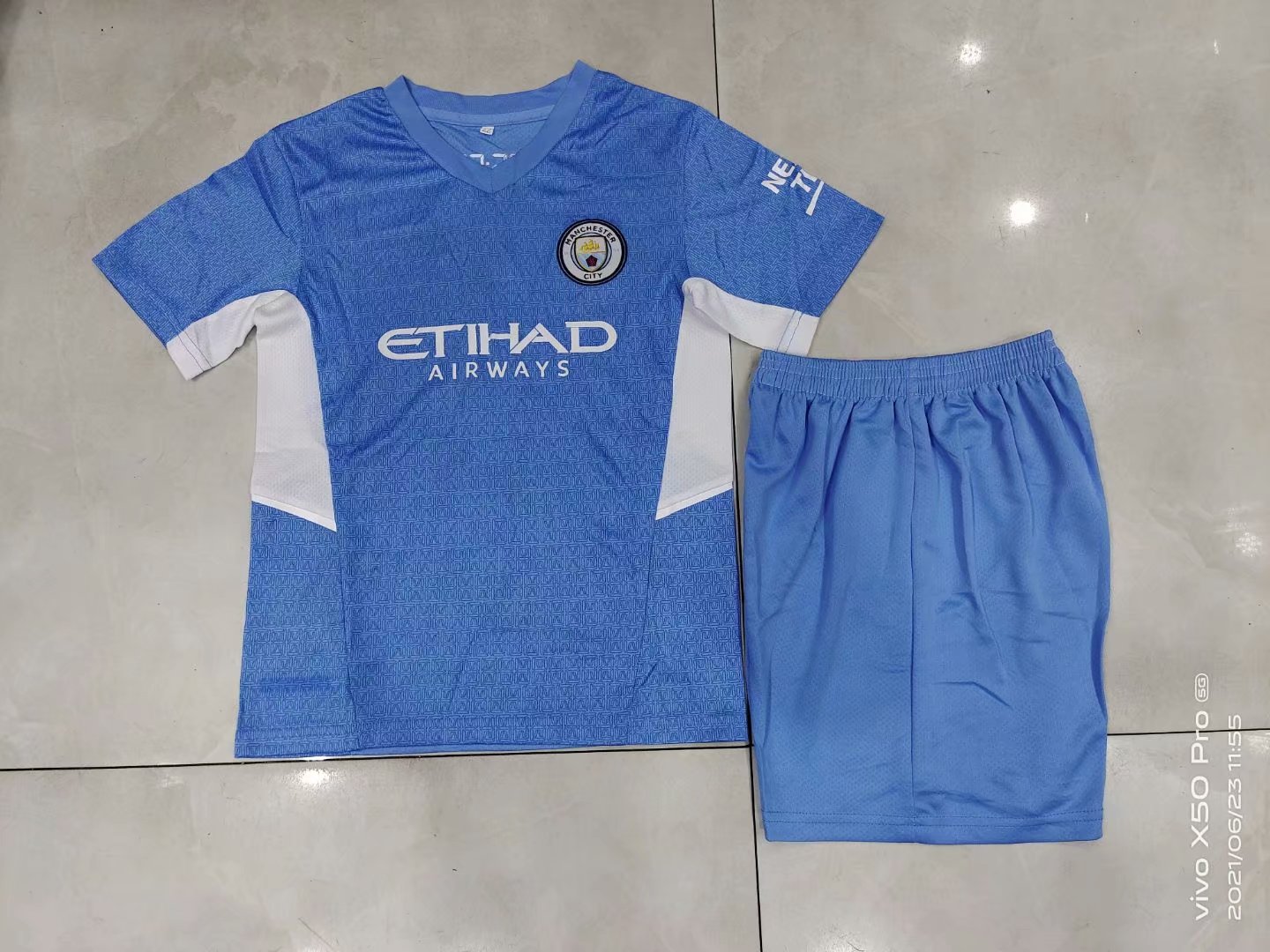 2021/2022 Manchester City Home kids kit have logo